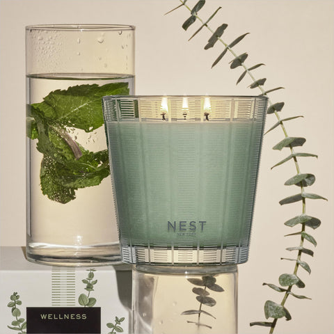 Sage glass vessel of NEST New York Wild Mint & Eucalyptus candle adds subtle decor