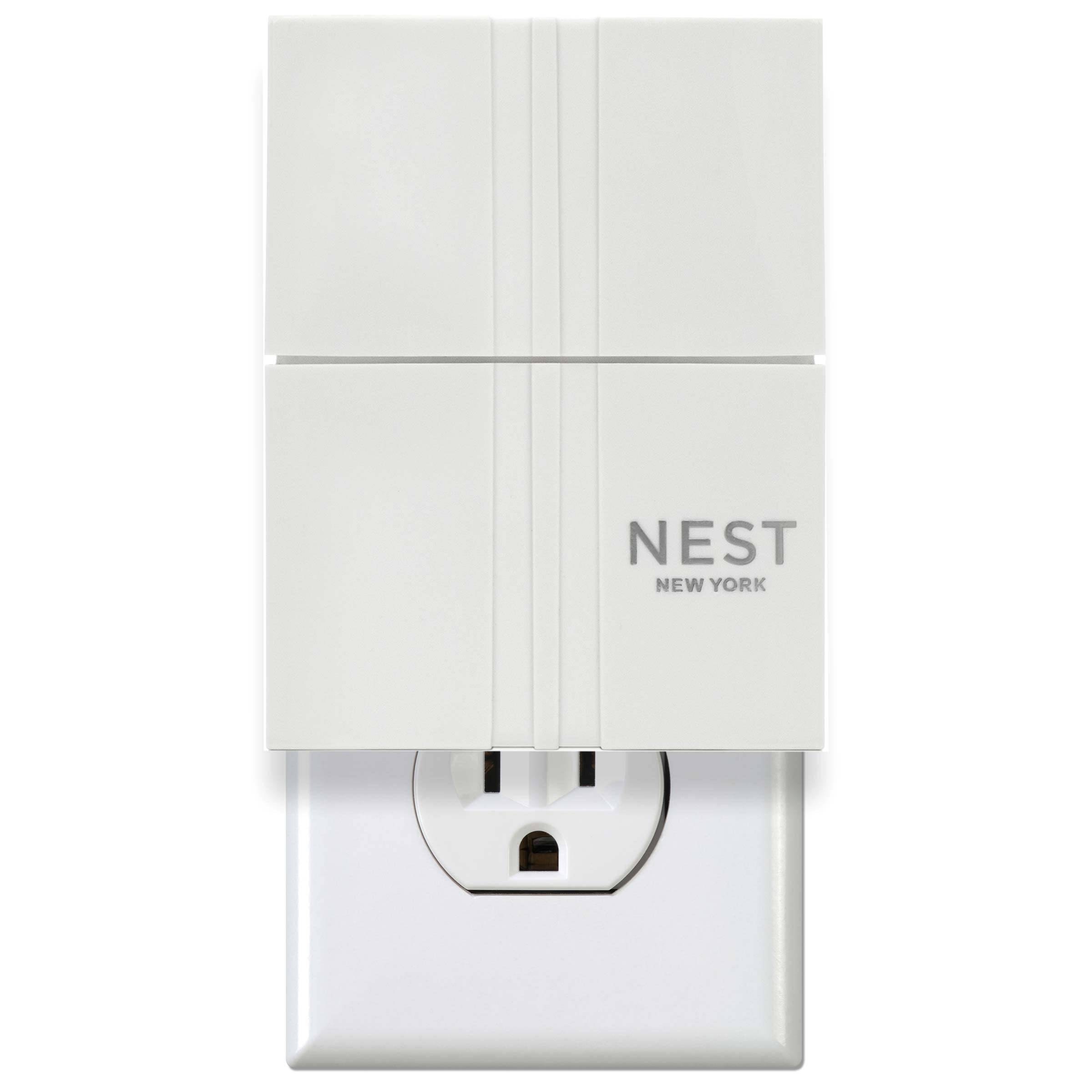 Nest New York wall diffuser plugged in at outlet for continuous fragrance throughout rooms.