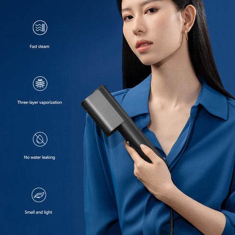 Nesugar G3 steamer in hand, ready heat for on-the-go freshening.