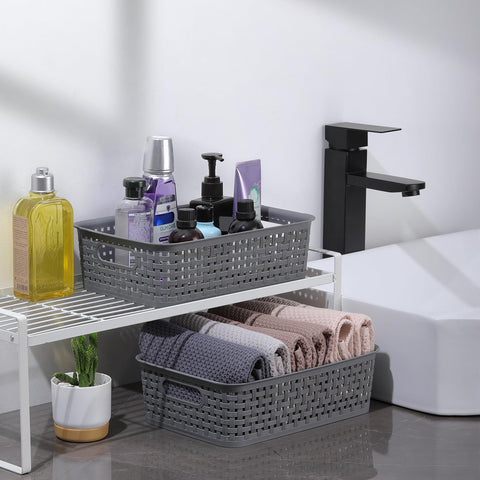 NETANY gray storage basket with hollow handles for easy transport.