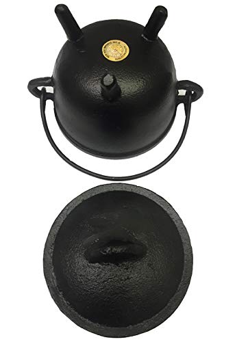 New Age Imports cauldron styled as Halloween decor centerpiece.