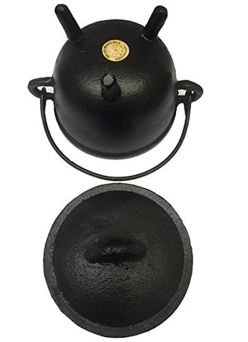 New Age Imports cauldron styled as Halloween decor centerpiece.
