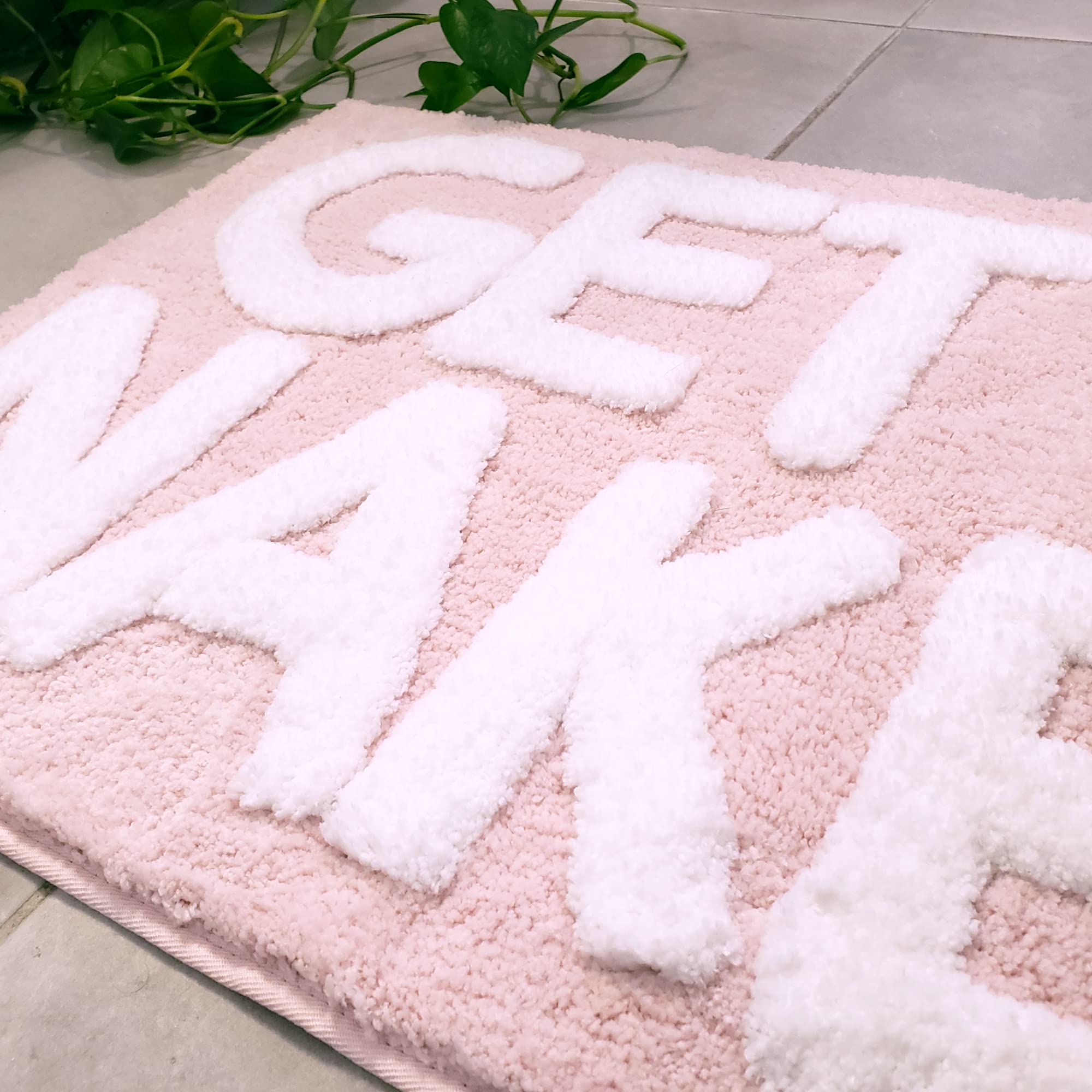 New Mungo Get Naked bath mat pink 31x20 inches shown in bathroom setup.