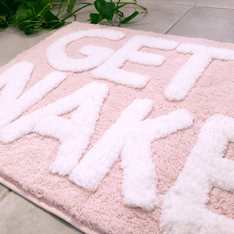 New Mungo Get Naked bath mat pink 31x20 inches shown in bathroom setup.