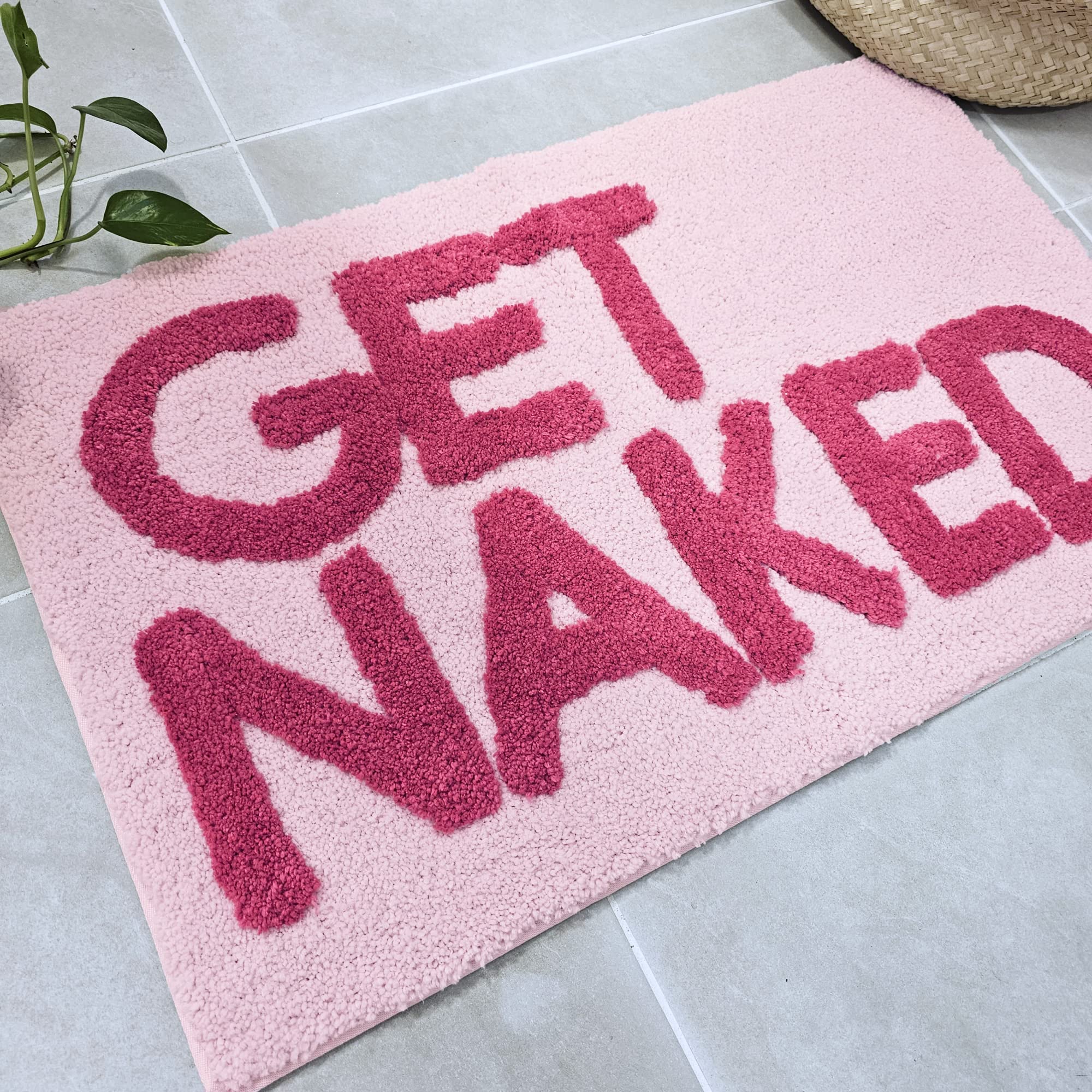 New Mungo Get Naked pink bath mat measures 31 by 20 inches.