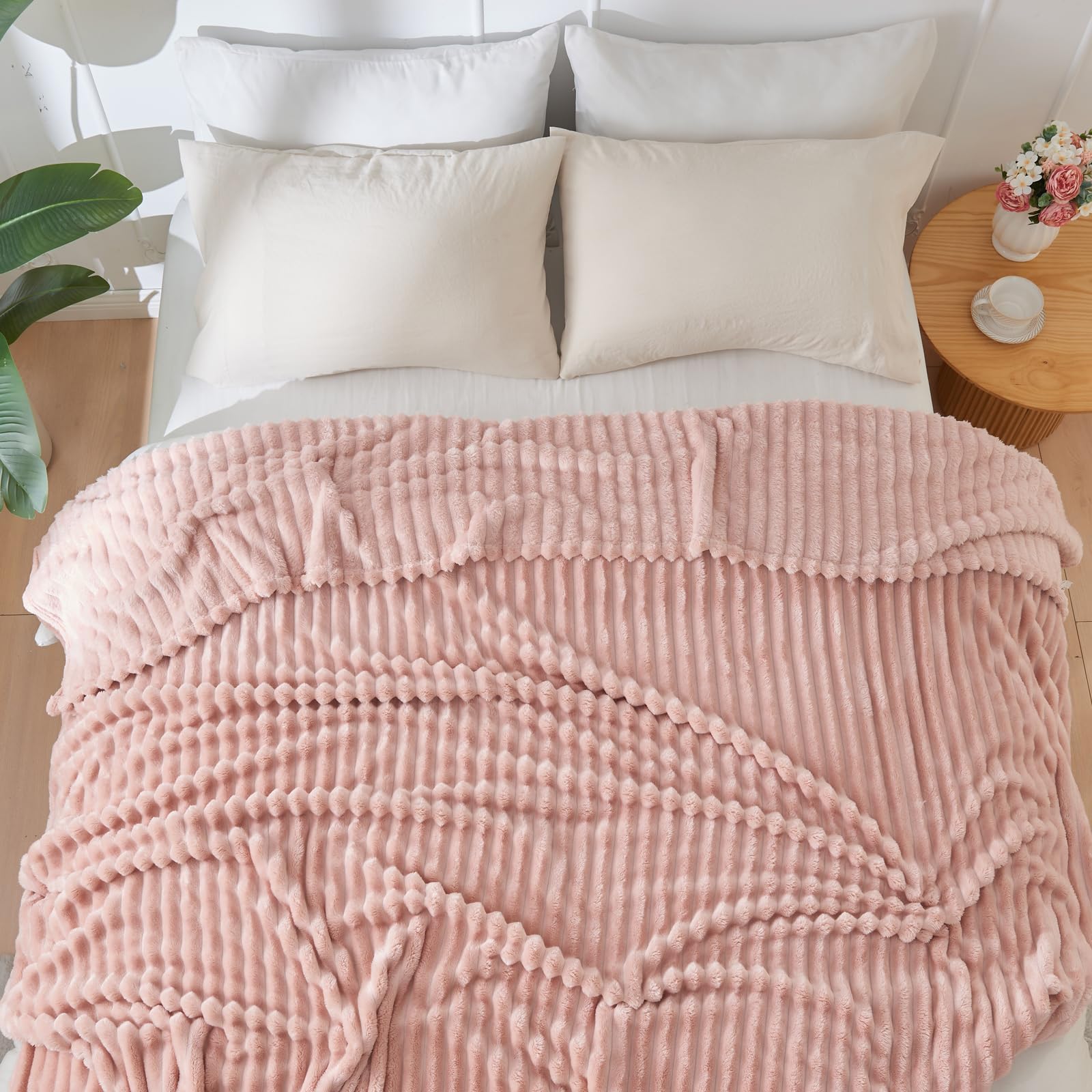 NEWCOSPLAY pink blanket complements bedroom décor with cozy charm