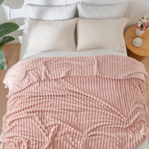 NEWCOSPLAY pink blanket complements bedroom décor with cozy charm