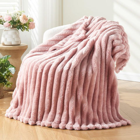 NEWCOSPLAY twin blanket in pink ribbed texture provides cozy warmth on chilly nights