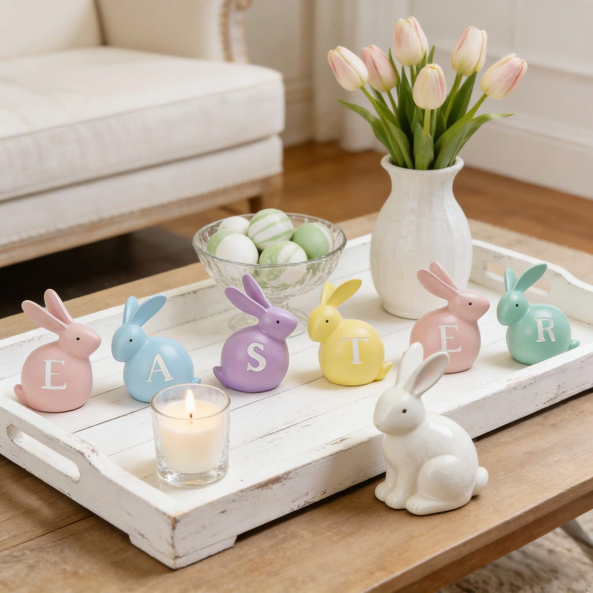 Newman House Studio Easter bunny centerpieces for table setup with six colorful hand-painted figurines.