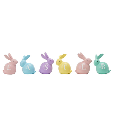 Newman House Studio hand-painted bunny figurines add festive color to spring tables.