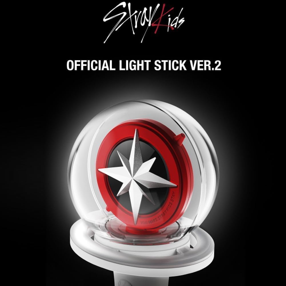 Close-up of Niaycouky lightstick with merch bracelets and 55 photocards