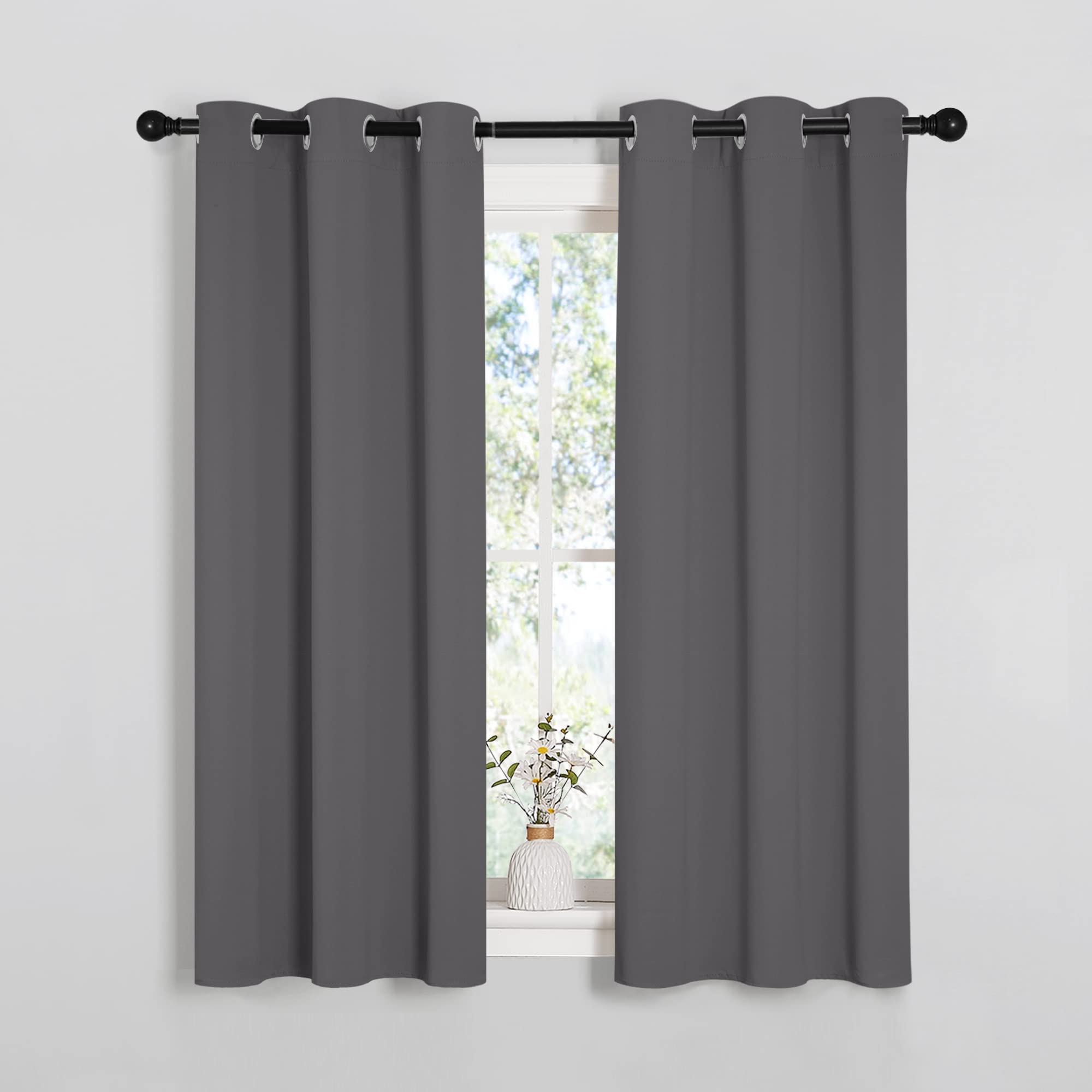 NICETOWN bedroom curtains silver grommet installation demonstrating simple hanging and privacy.