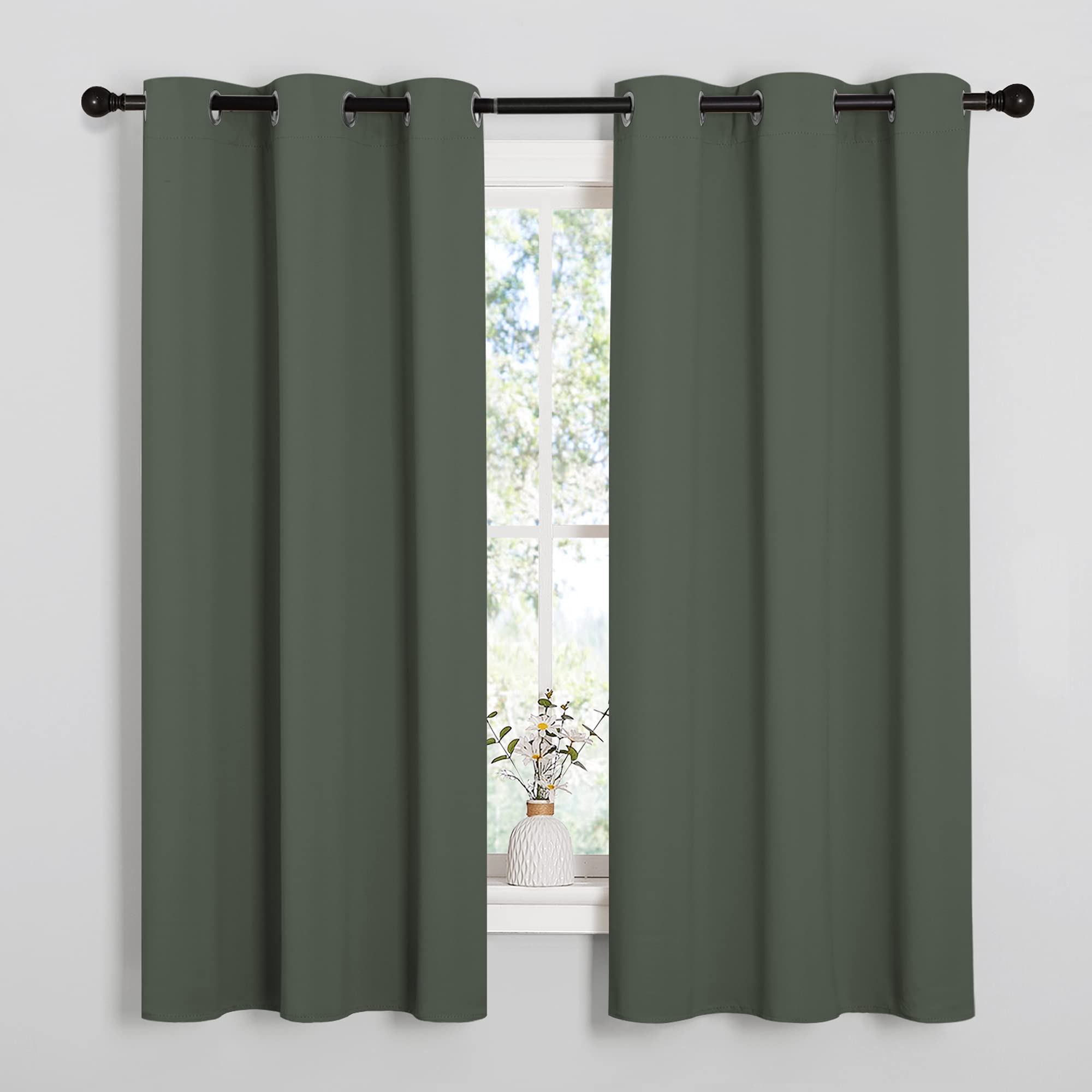 NICETOWN blackout curtain panel in Dark Mallard blocks light for cinema-like viewing.