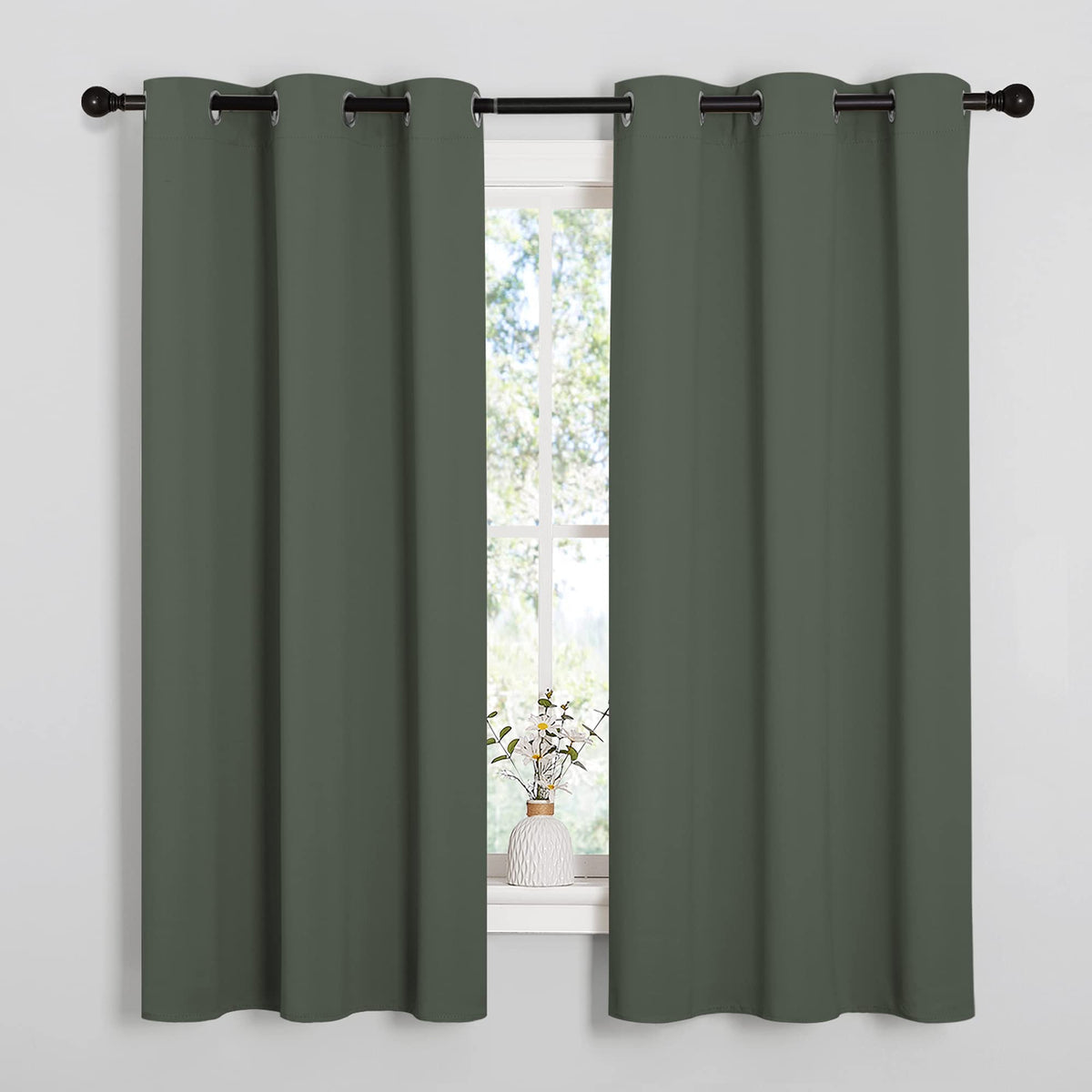 NICETOWN blackout curtain panel in Dark Mallard blocks light for cinema-like viewing.
