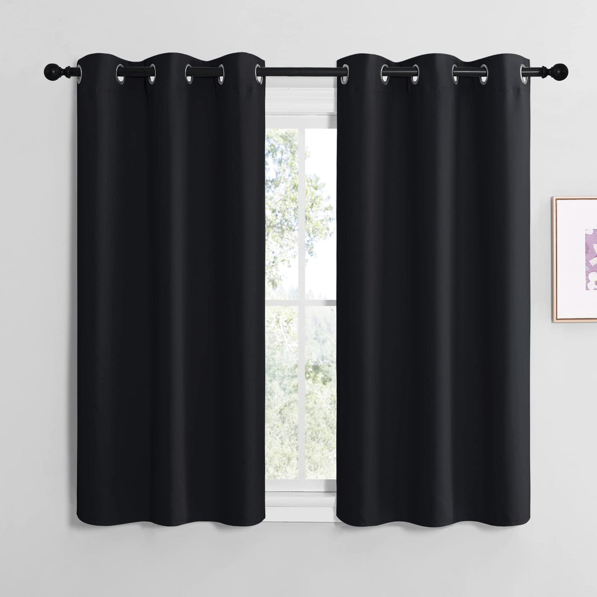 NICETOWN blackout curtains with grommet detail block light and add modern style.