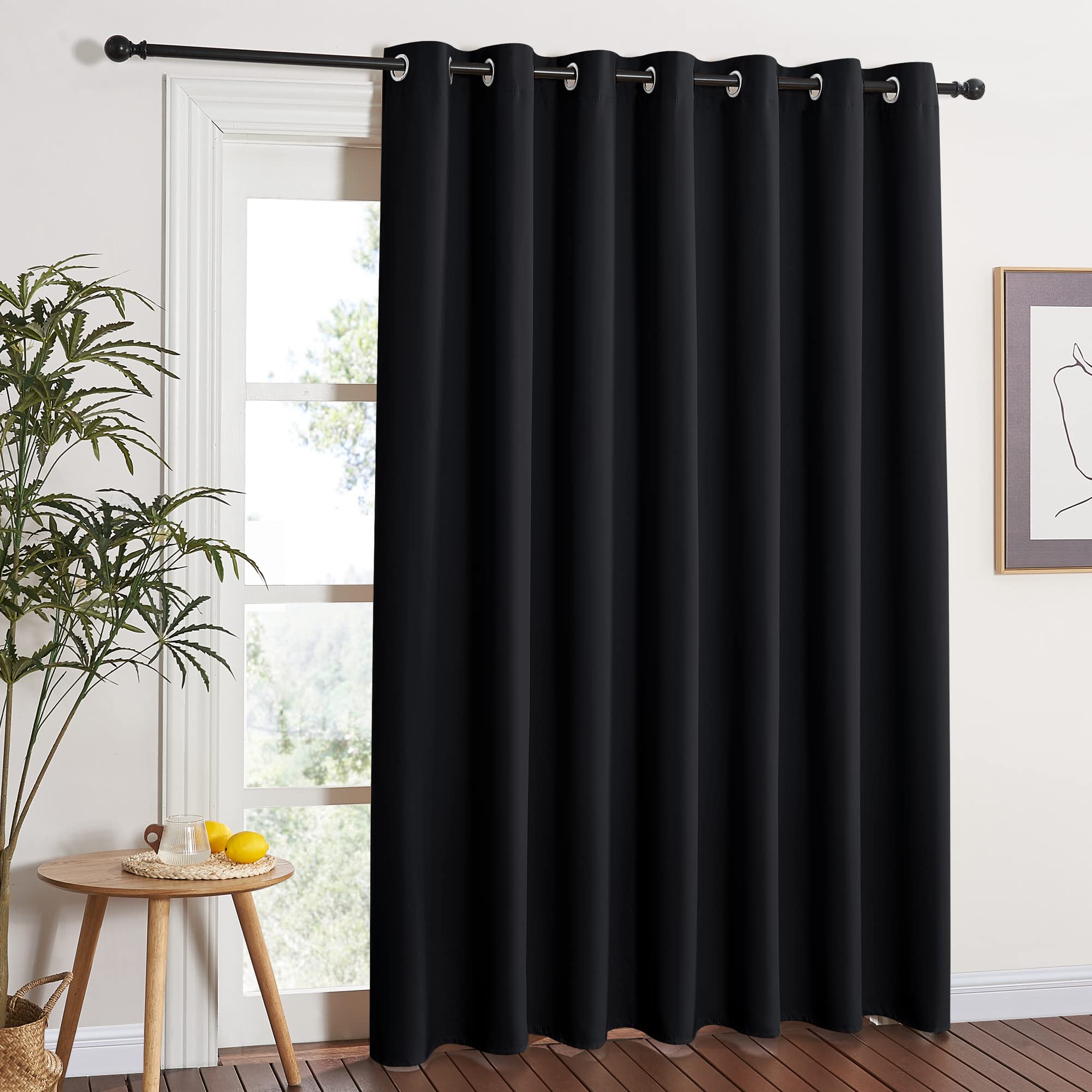 NICETOWN blackout sliding door curtain with wide coverage blocks sunlight and glare.