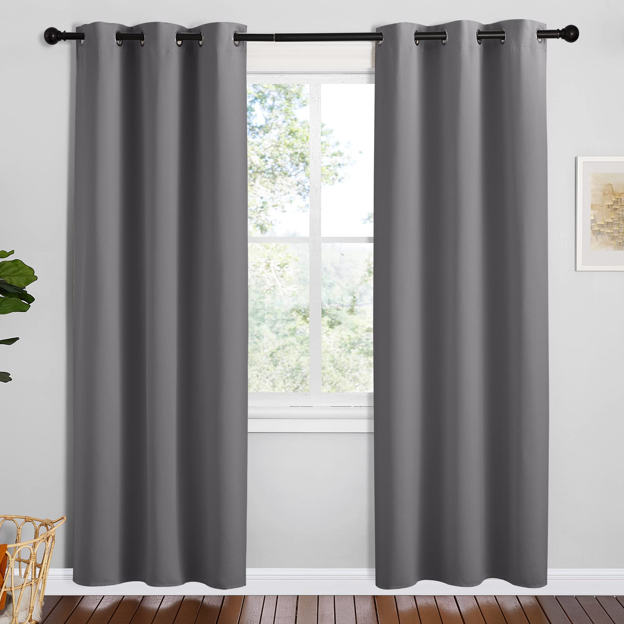 NICETOWN grey blackout curtain panel with silver grommets for smooth opening and privacy.