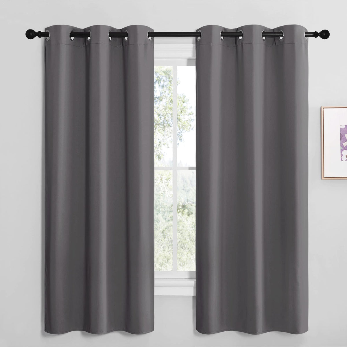 NICETOWN grey blackout curtain panel blocks light for bedrooms.