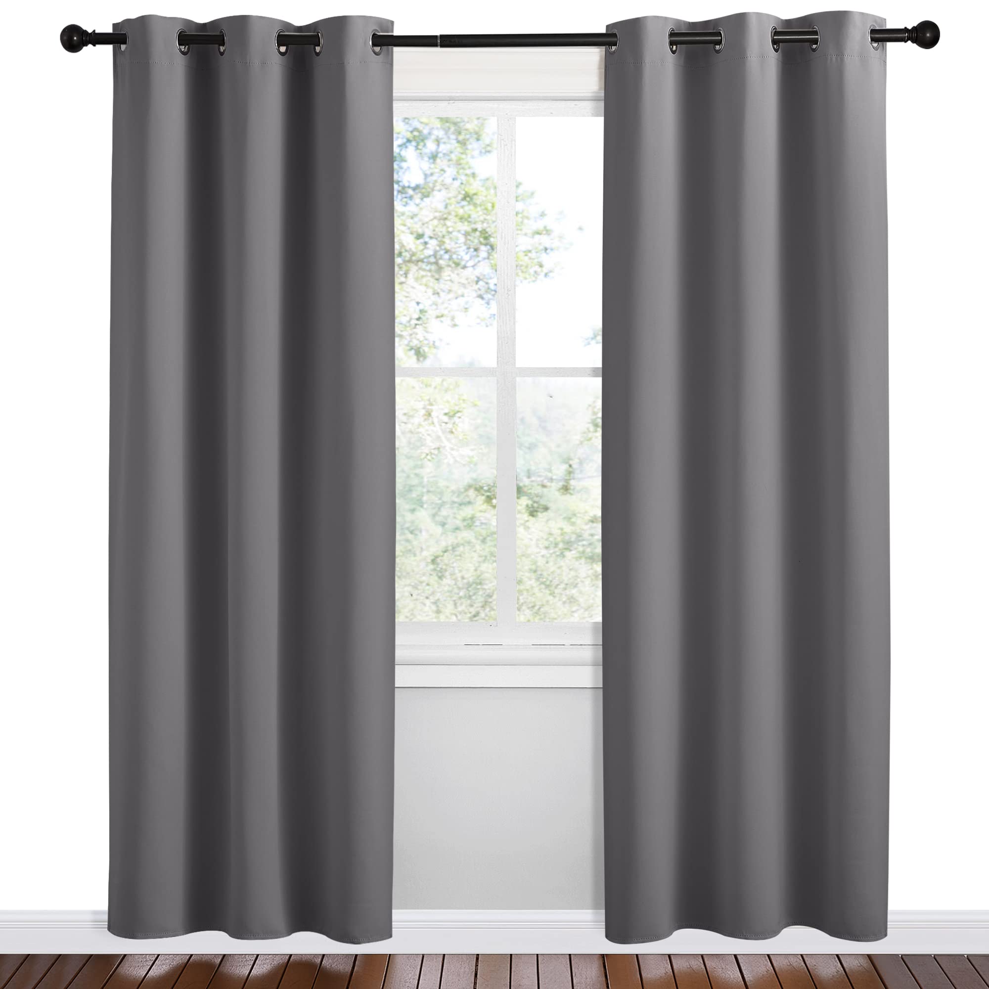 NICETOWN grey blackout curtain panel showing wide drape texture in a living room.