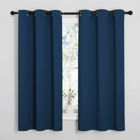 NICETOWN Moroccan blue blackout curtains block light for a calmer bedroom.