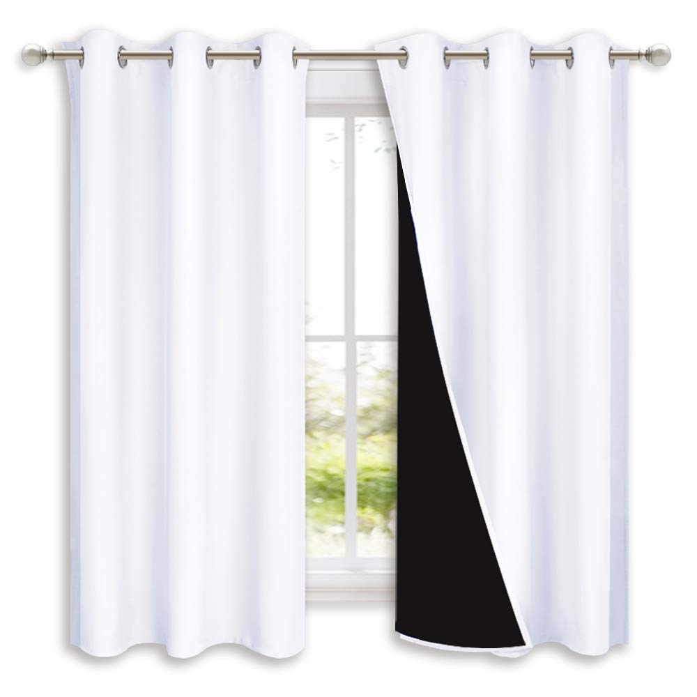 NICETOWN Pure White blackout curtains with silver grommets block light for focused daytime rest