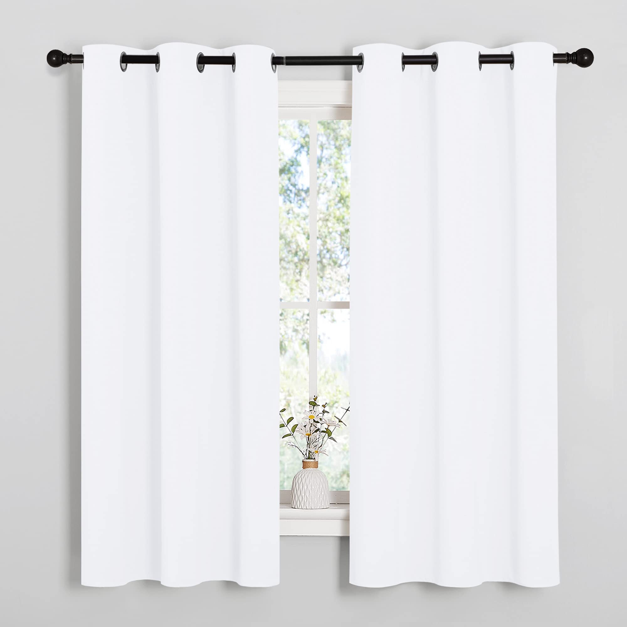 NICETOWN white curtain close-up with silver grommets for smooth sliding.