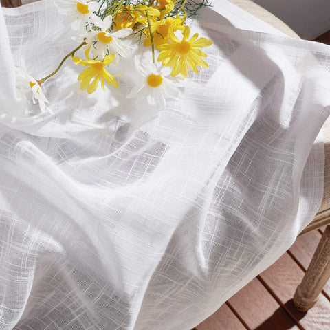 Bedroom setup featuring NICETOWN sheer linen curtains with elegant drape