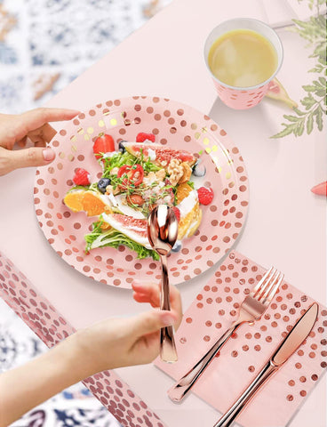 Nkaiso rose gold utensil set with forks, spoons, and knives.