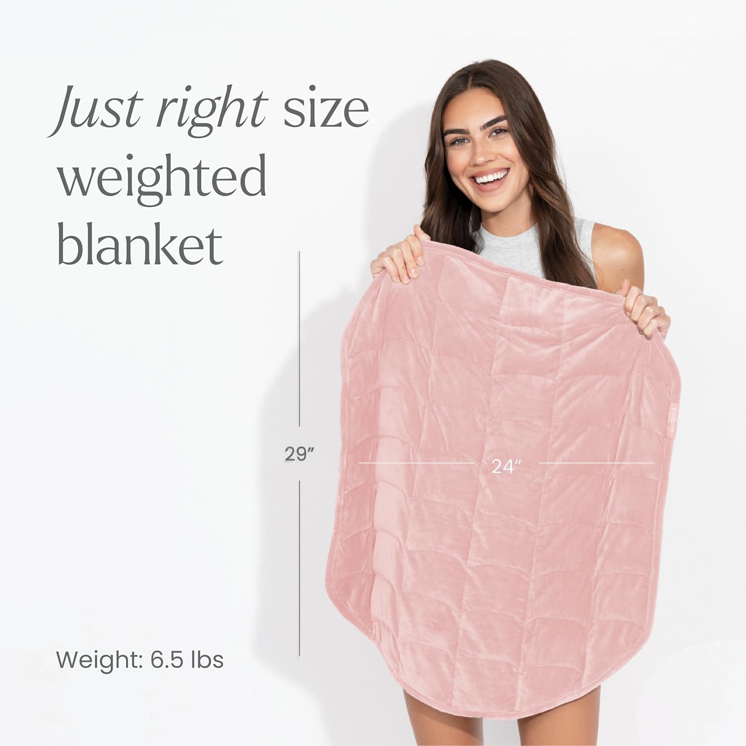 Nodpod Body compact weighted blanket shown on a bed for easy travel and comfort