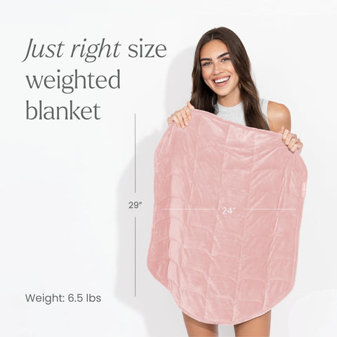 Nodpod Body compact weighted blanket shown on a bed for easy travel and comfort