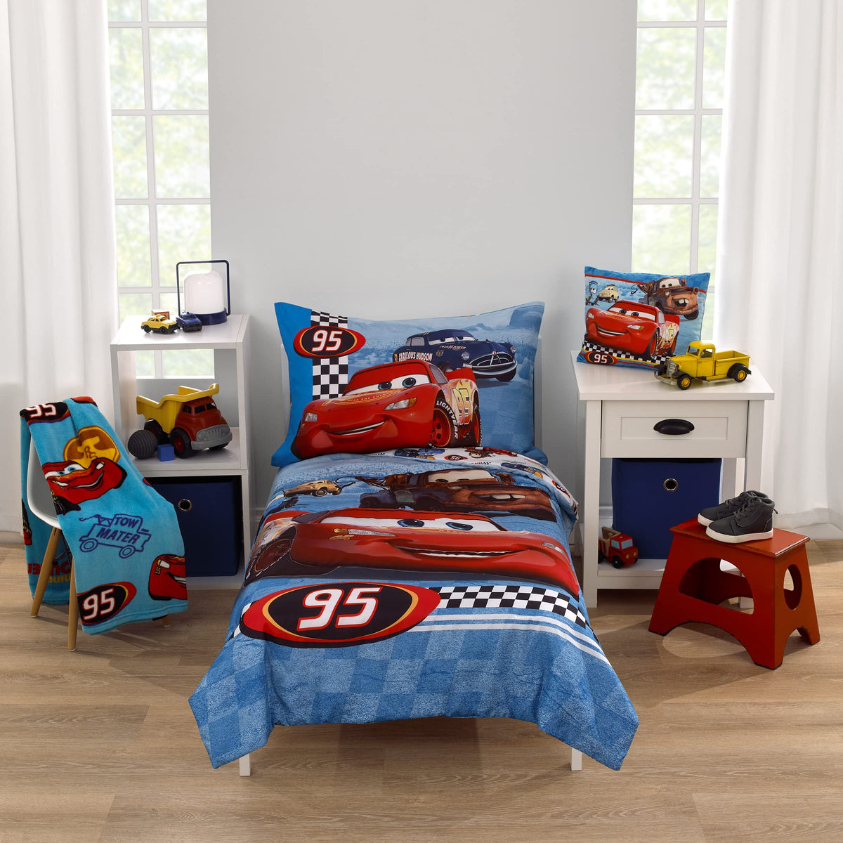 NoJo Disney Cars Radiator Springs comforter adds colorful storytelling to a toddler bed.