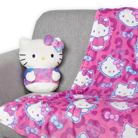 Northwest Hello Kitty pattern closeup shows cheerful motifs on a pink backdrop.