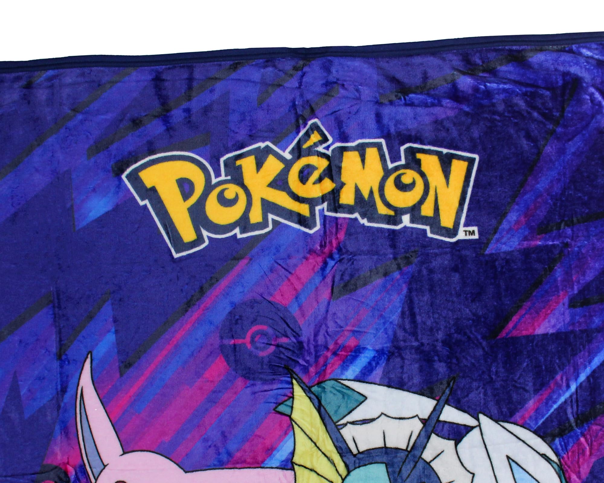 Northwest logo and Gotta Catch 'Em All design on plush throw.