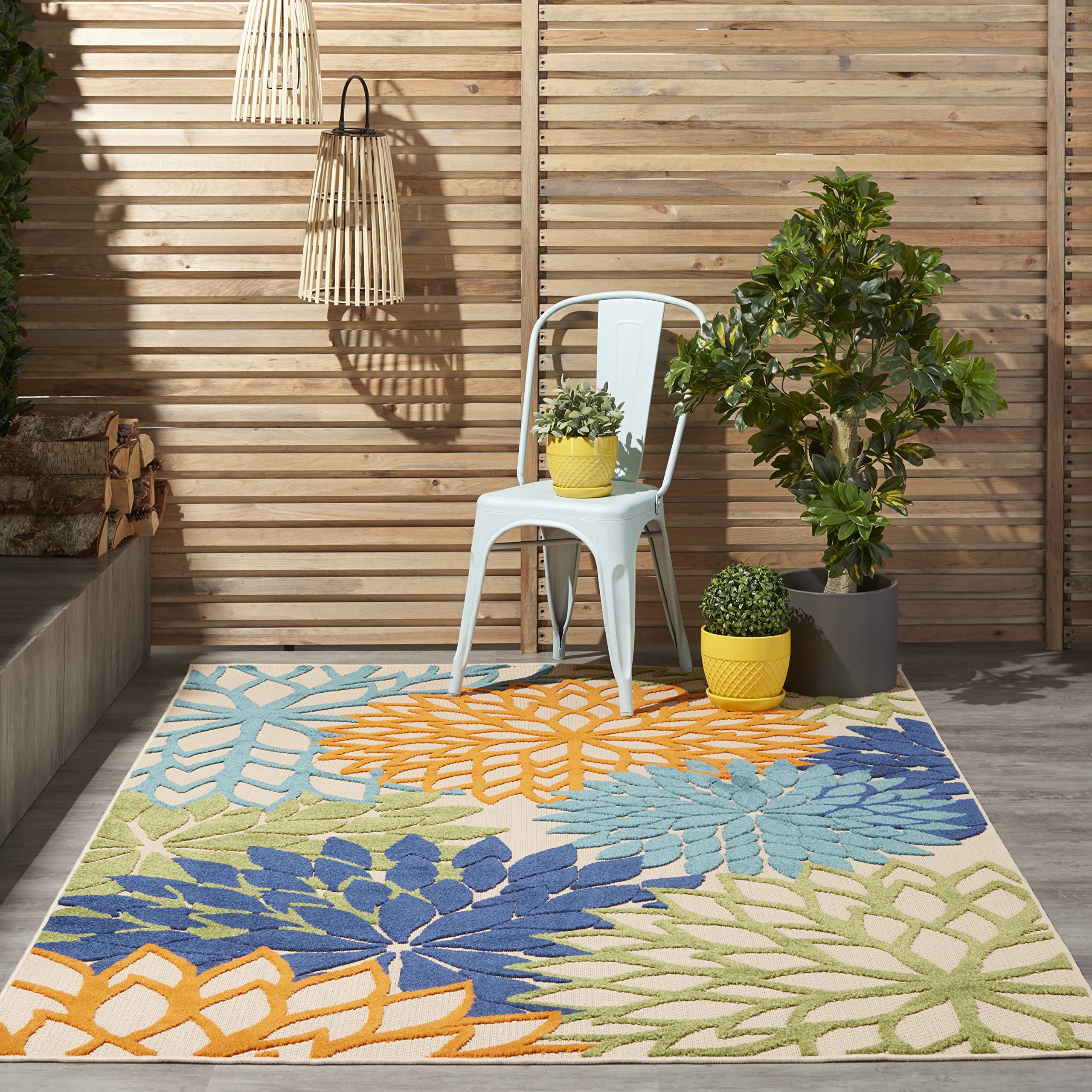 Nourison Aloha blue floral rug for bright patio spaces.