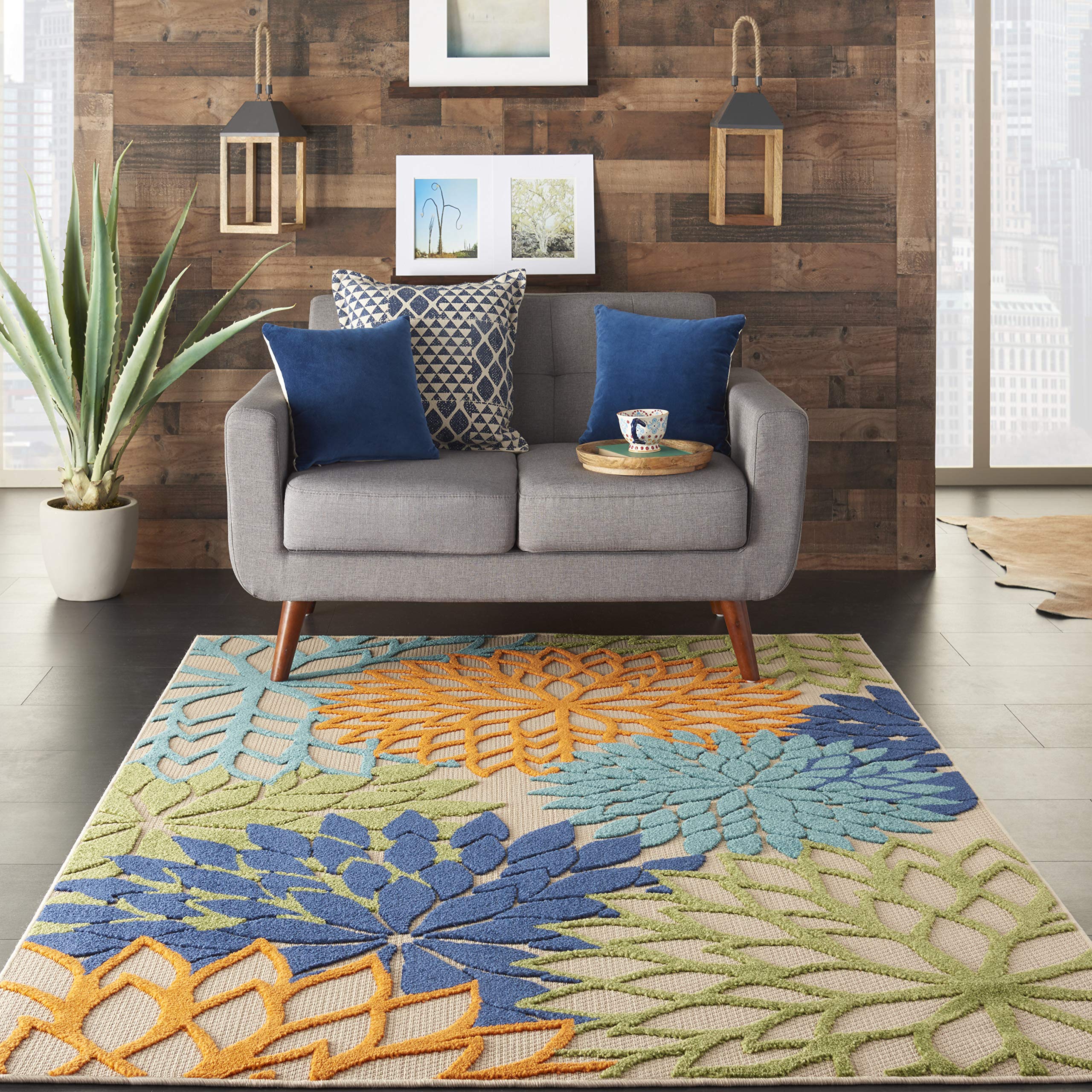 Nourison Aloha orange floral accents brighten porch decor.
