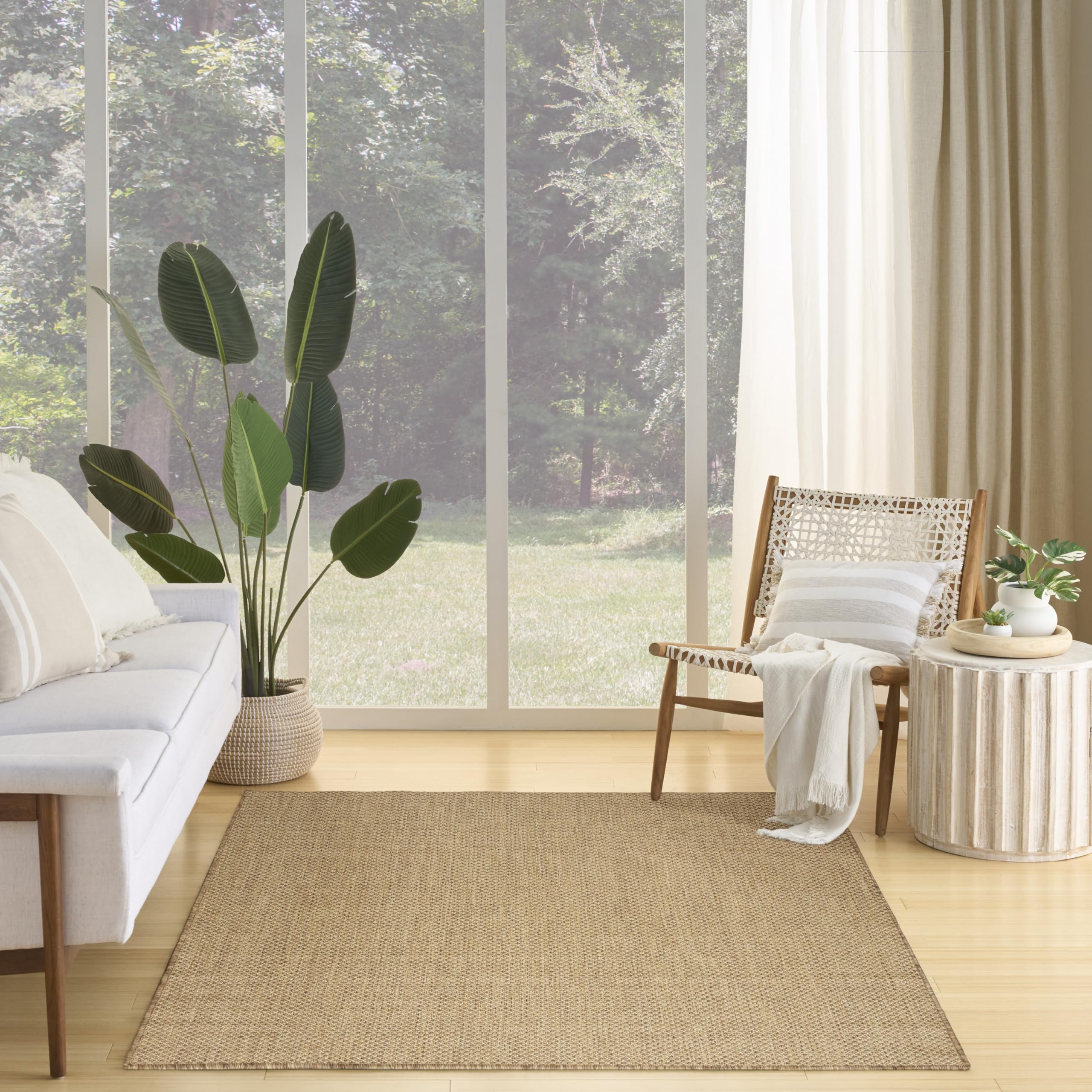 Nourison Courtyard rug showcasing geometric pattern in ivory and silver grey for modern interiors