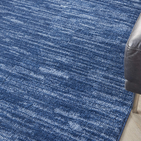Nourison Essentials navy blue borderless design adds subtle style and pairs with patterned rugs