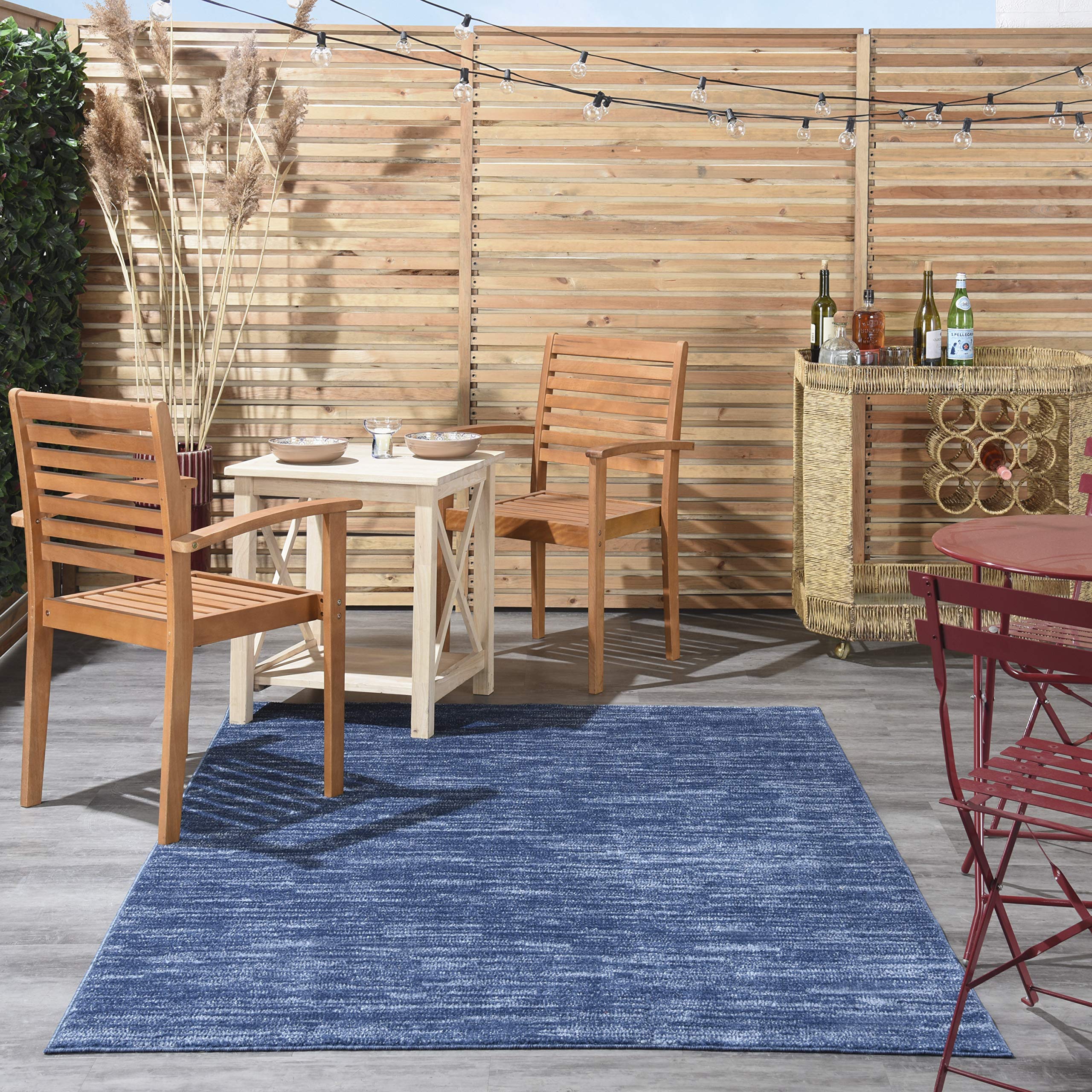 Nourison Essentials navy blue rug suited for indoor or outdoor spaces