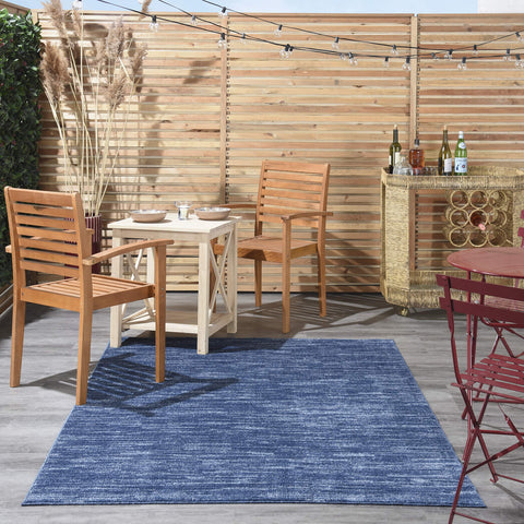 Nourison Essentials navy blue rug suited for indoor or outdoor spaces