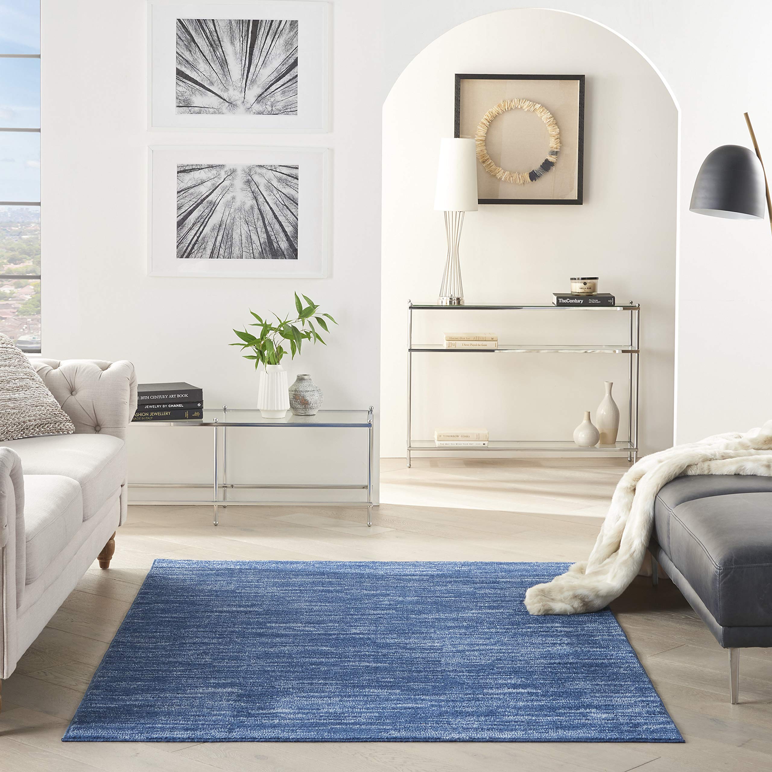 Nourison Essentials navy blue rug with serged edge for durable, crisp outlines