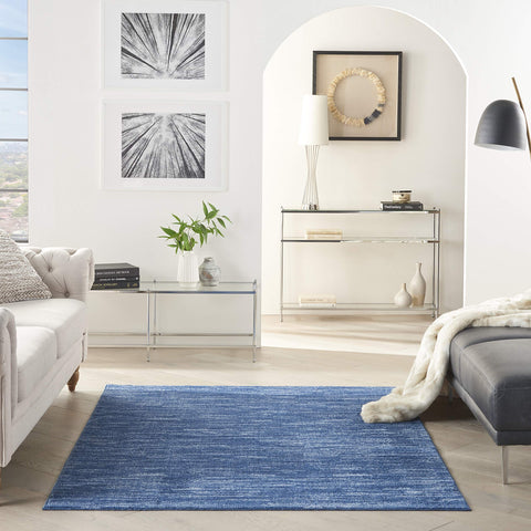 Nourison Essentials navy blue rug with serged edge for durable, crisp outlines