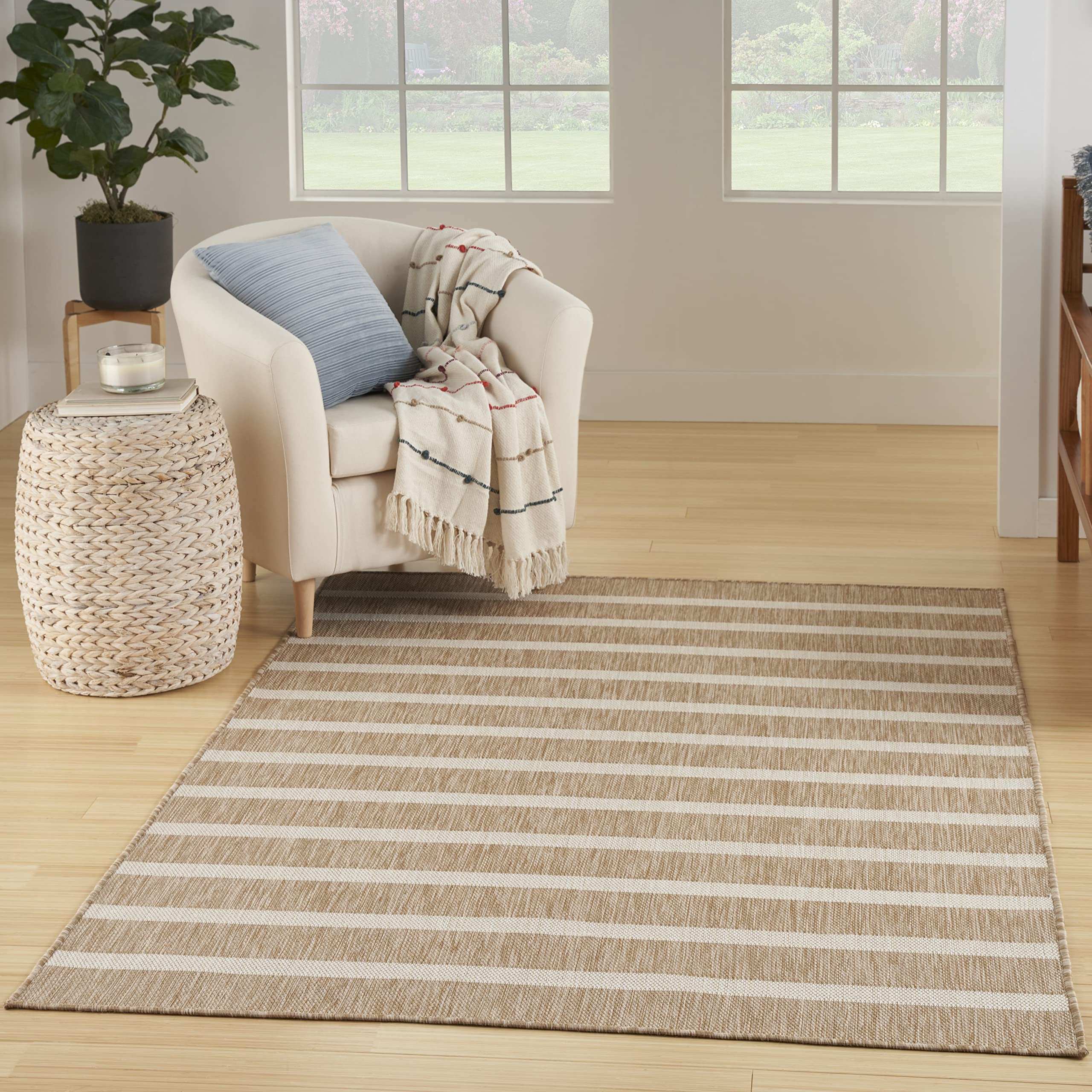 Nourison Positano beige-ivory stripe area rug highlights coastal style and easy cleaning