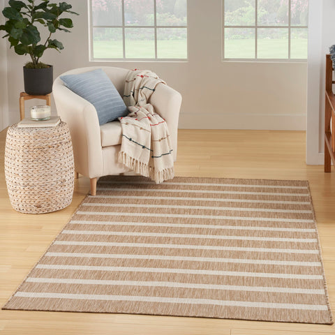 Nourison Positano beige-ivory stripe area rug highlights coastal style and easy cleaning