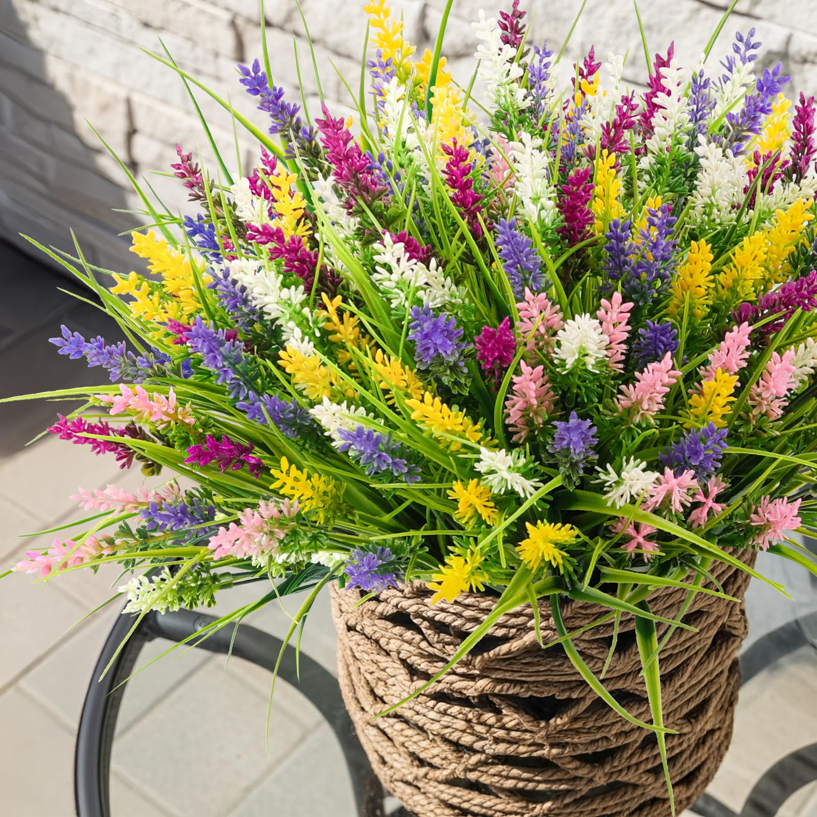 NT NIETING artificial grass with yellow flowers brightens walkways and patios.