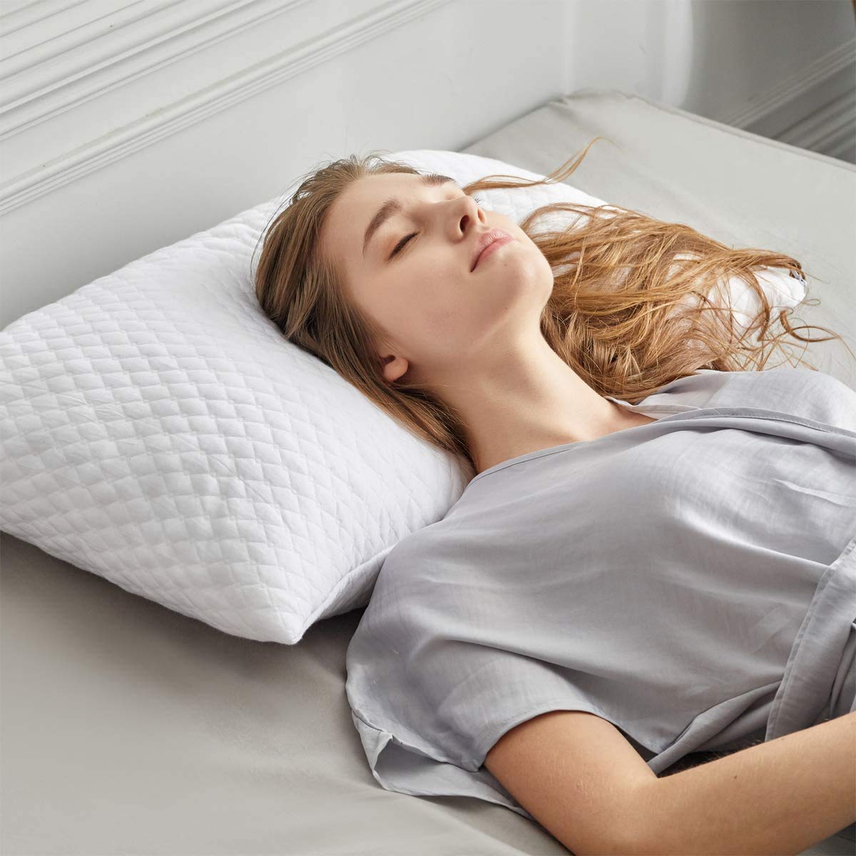NTCOCO memory foam pillow side view highlighting adjustable height.