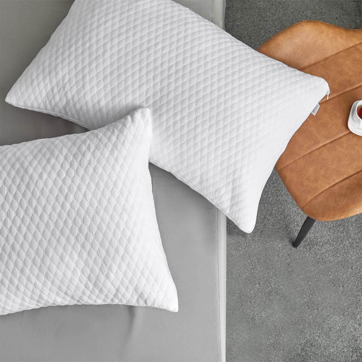 NTCOCO vacuum-packaged pillow protecting foam elasticity.