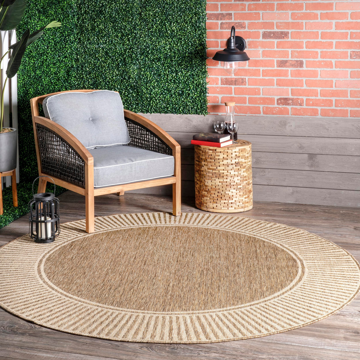 nuLOOM Asha border-striped round rug defines outdoor seating areas