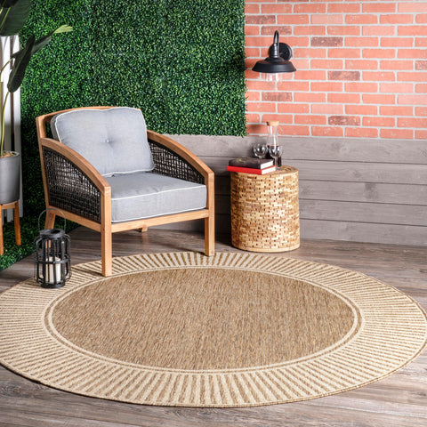 nuLOOM Asha border-striped round rug defines outdoor seating areas