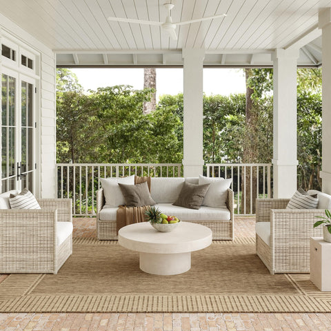 nuLOOM Asha indoor/outdoor rug with striped border defines outdoor seating.
