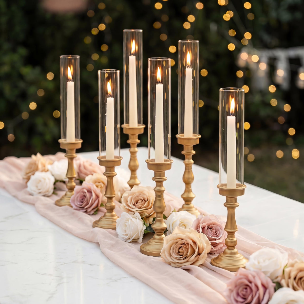 NUPTIO Gold candlestick holders set of 6 with tall silhouettes for elegant tabletops.